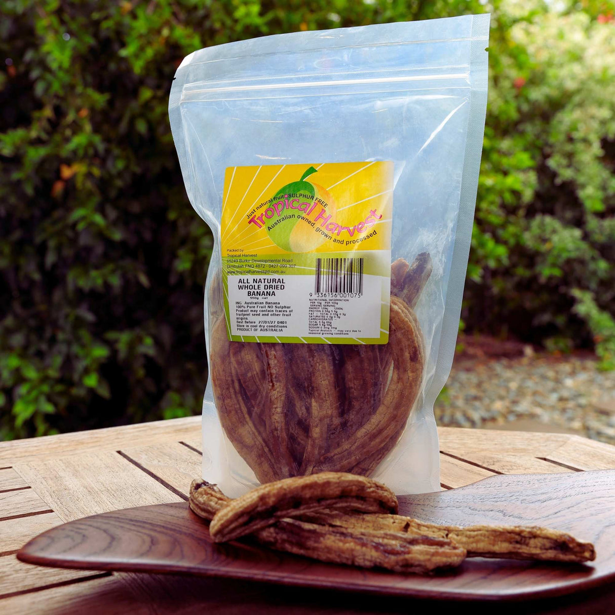Australian dried banana whole in a 550g resealable pack photographed outdoors showing natural dried fruit pieces