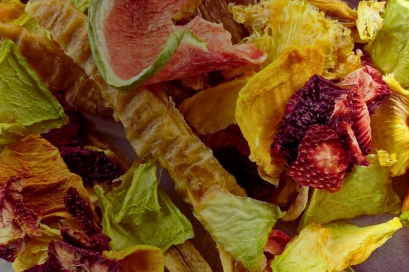 Close-up of colourful Australian dried fruit mix including mango, pineapple, banana, strawberry, lime, and watermelon – showcasing variety and texture in bulk a sample packs.