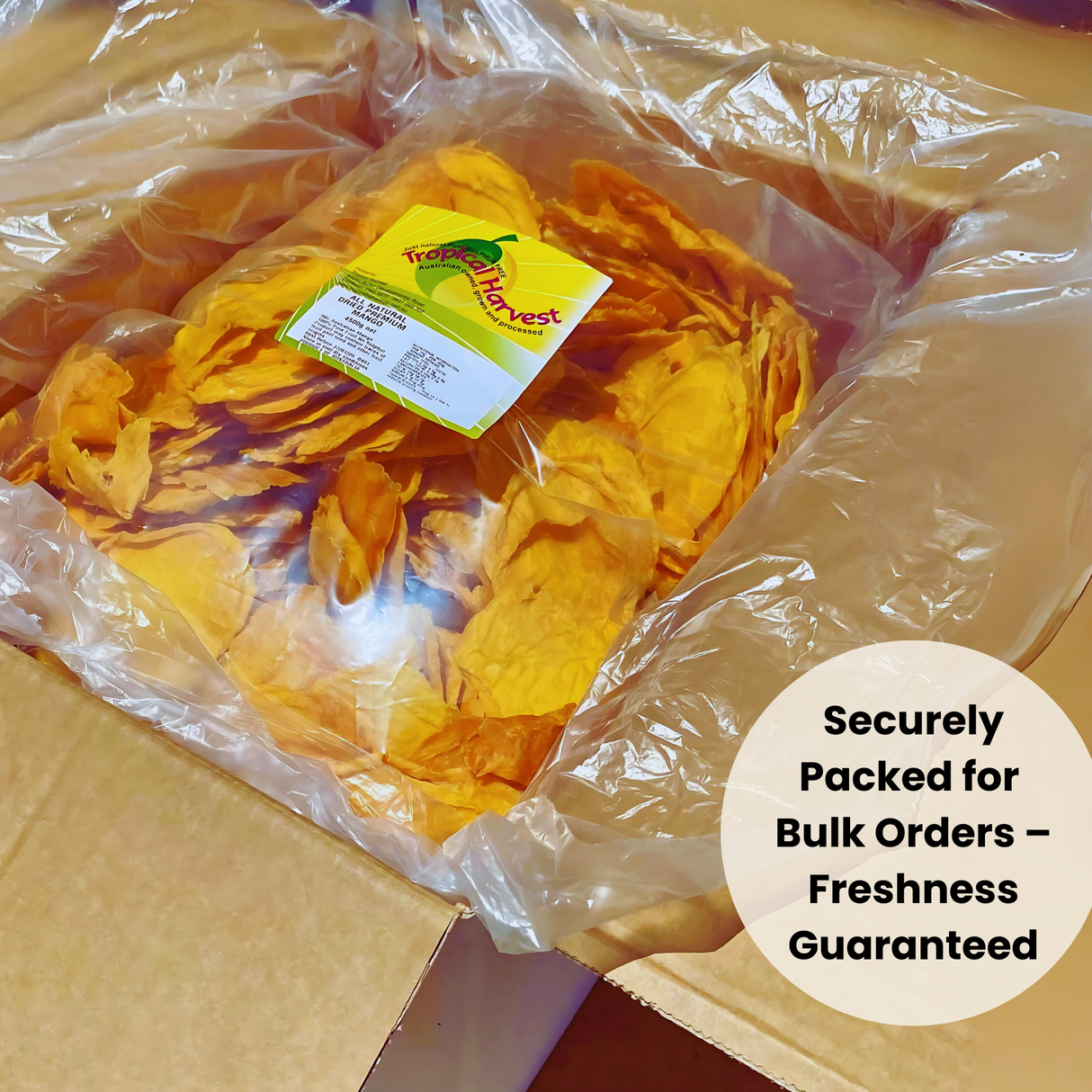 A 4.5kg bulk pack of premium Australian dried mango securely packed inside a protective box with clear plastic wrapping. Green badge overlay reads "Securely Packed for Bulk Orders – Freshness Guaranteed." Ensures safe delivery and freshness.