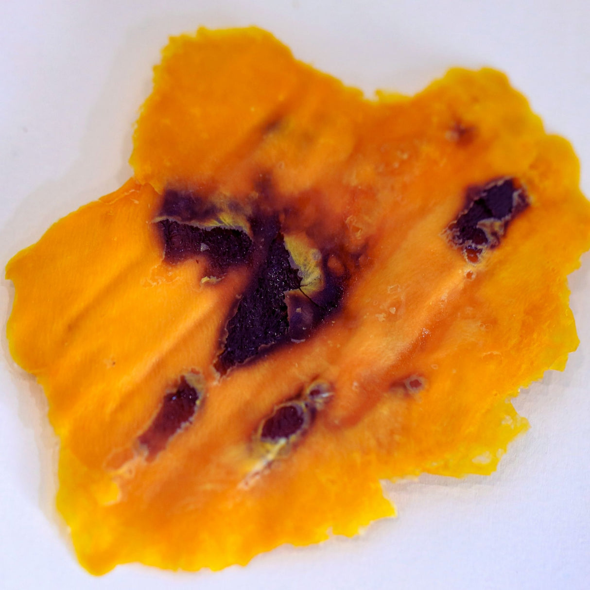 Texture close-up of Australian dried mango with natural caramelised sugars formed during slow drying.