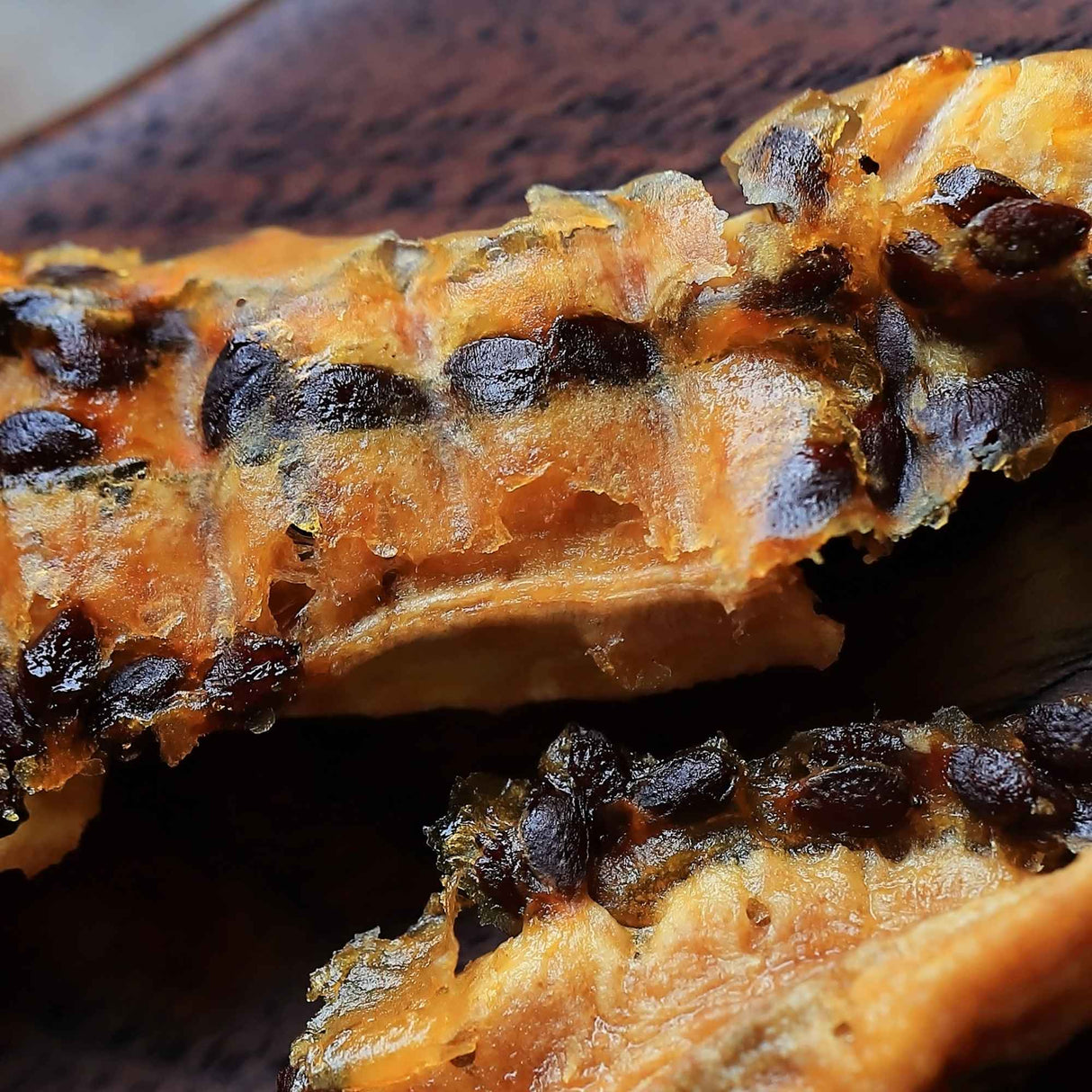 Chewy dried banana infused with passionfruit showing soft texture and natural fruit fibers