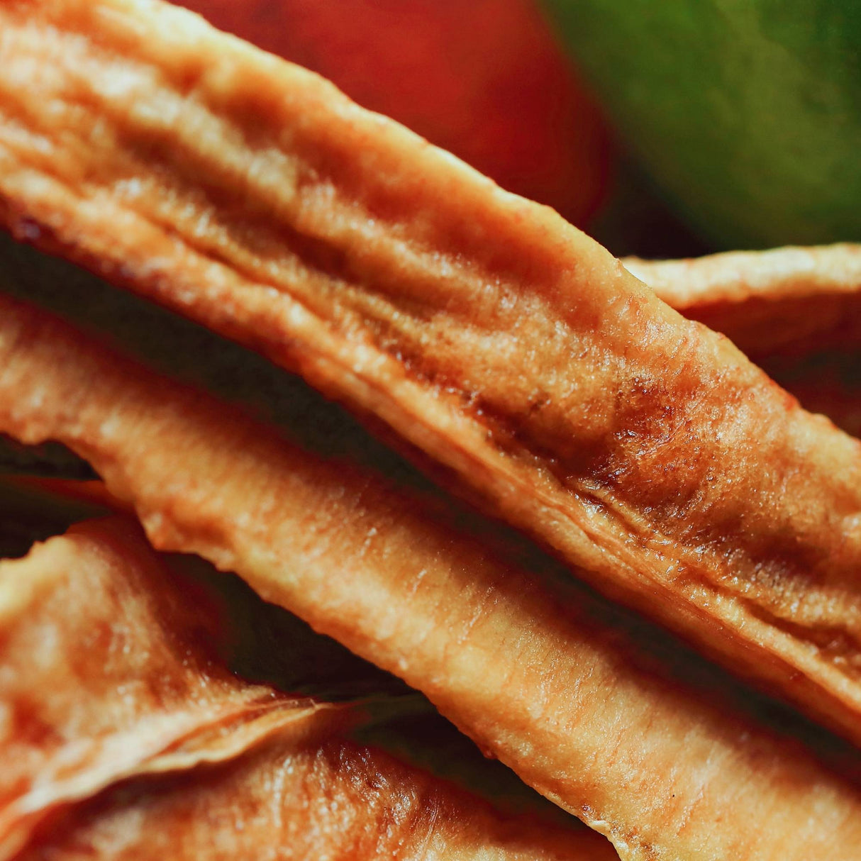 Close up of Australian dried banana with lime showing chewy texture and natural banana fibres with a citrus finish