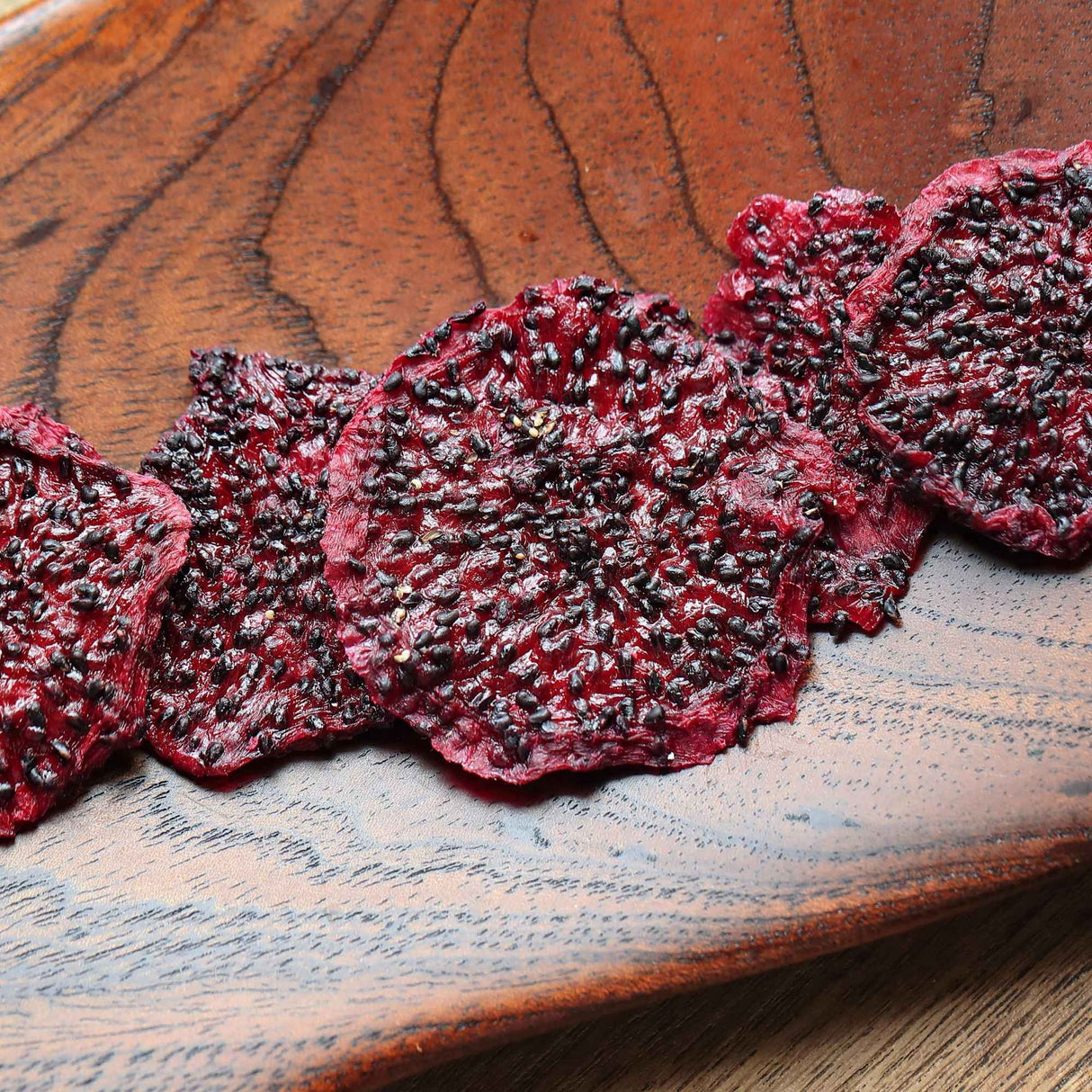 Dried dragon fruit slices served on board healthy snack idea