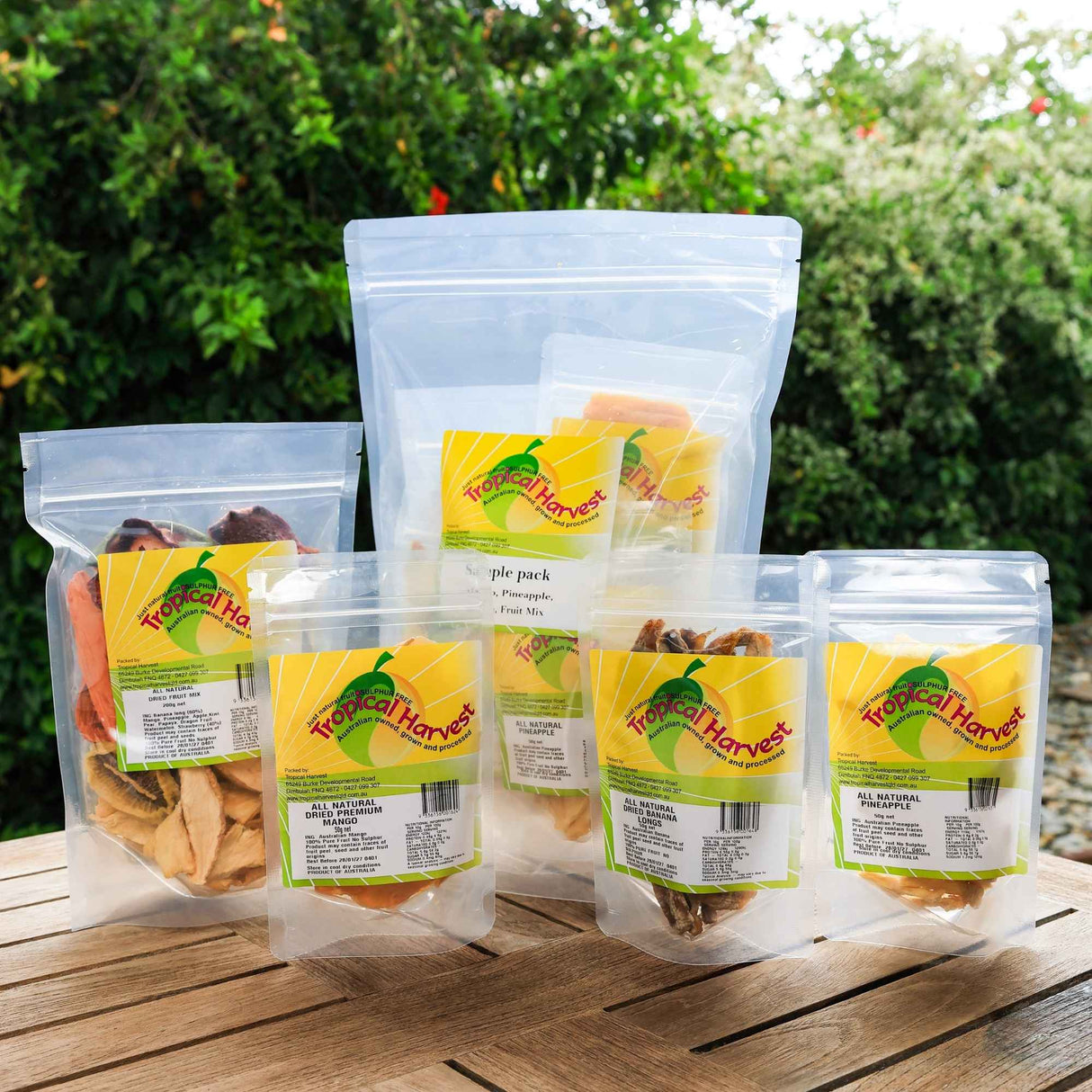 Variety of Australian dried fruit sample packs showing mango, pineapple, banana and fruit mix