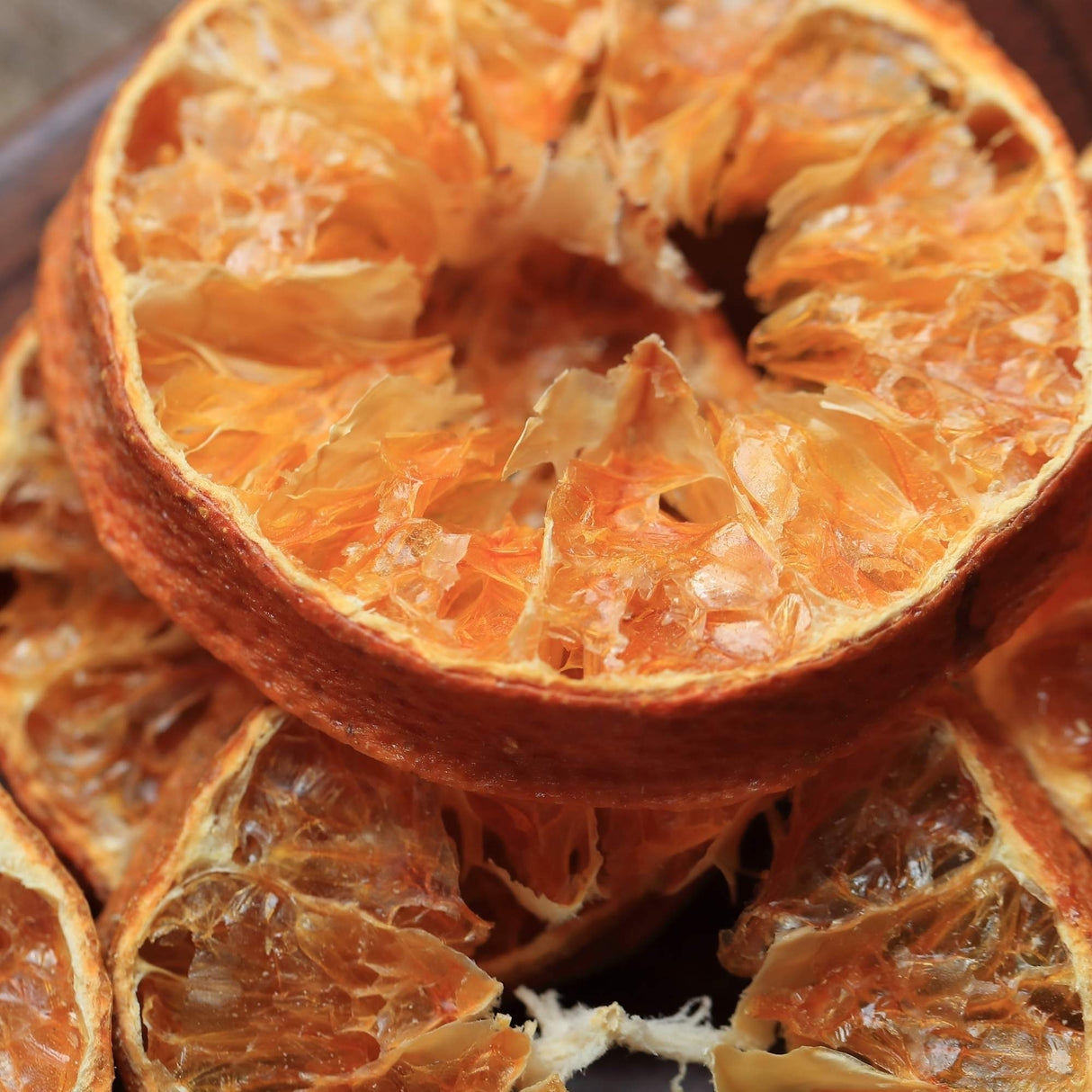 Close-up of dried mandarin slice showing natural citrus texture and rich color
