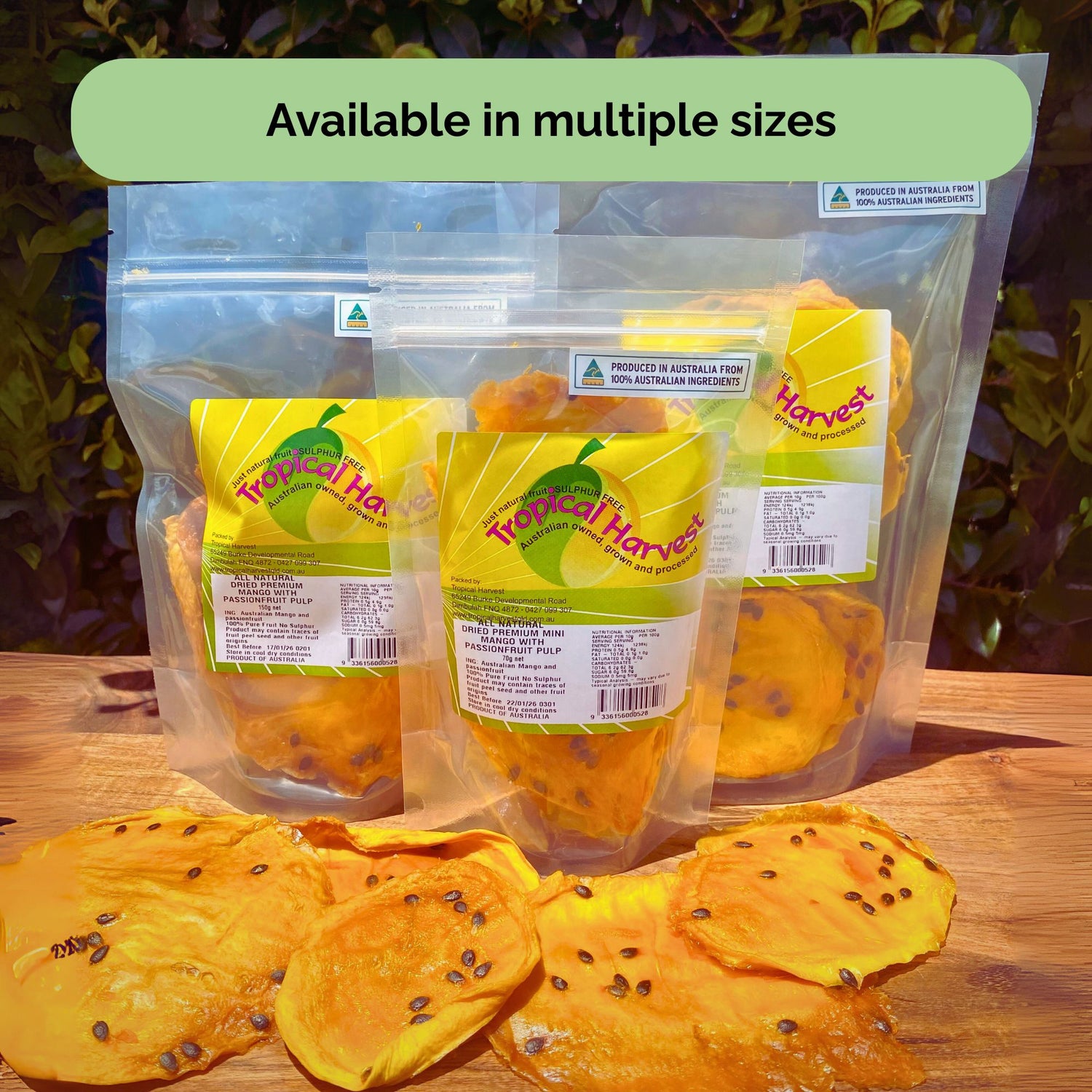 Three resealable bags of Australian dried passionfruit mango in 70 g, 150 g, and 350 g sizes, with loose slices in front to show texture and size.