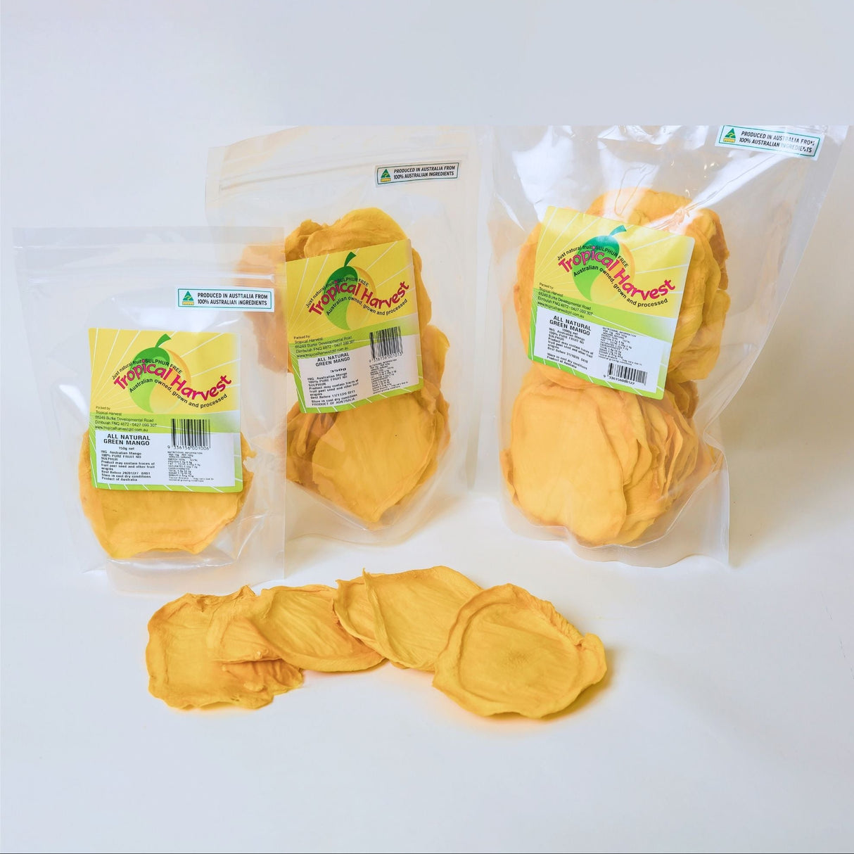 150g, 350g and 1kg packs of Green Australian dried mango displayed together with sliced mango.