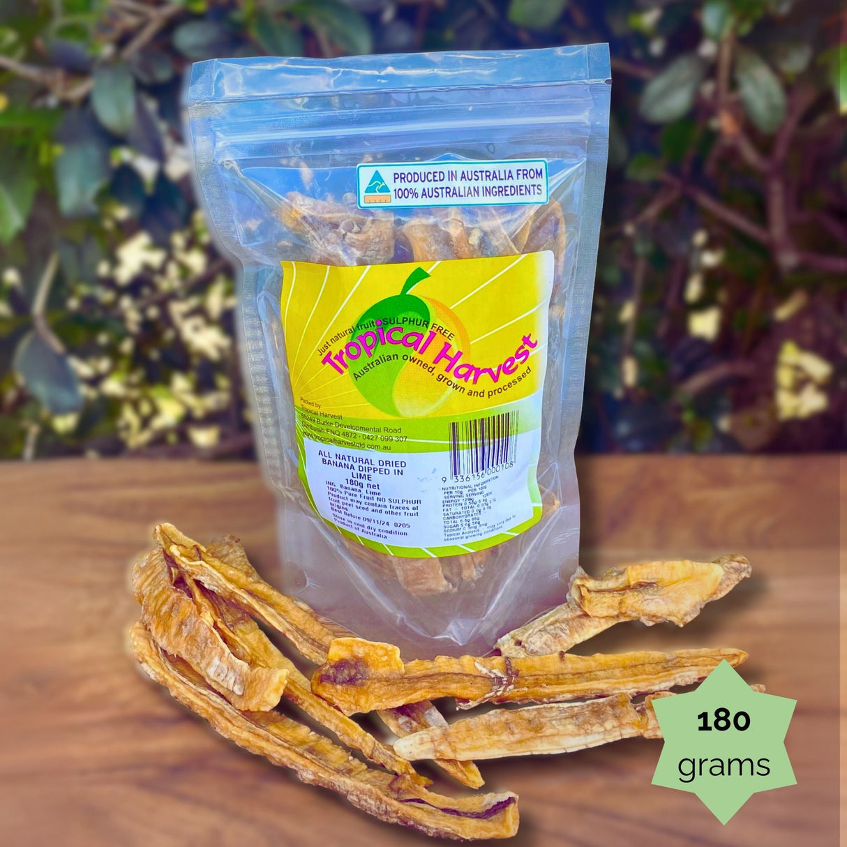 180g Tropical Harvest dried banana lime resealable pouch with chewy banana slices displayed. Perfect for lunchboxes or on-the-go citrus snacking.