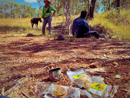 Tropical Harvest dried fruit packs during a bush break in the Australian outback with horse and riders in background