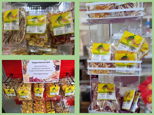Tropical Harvest dried fruit displayed in retail stores across Australia — on shelves, peg hooks, and racks, with visible packaging and labels.