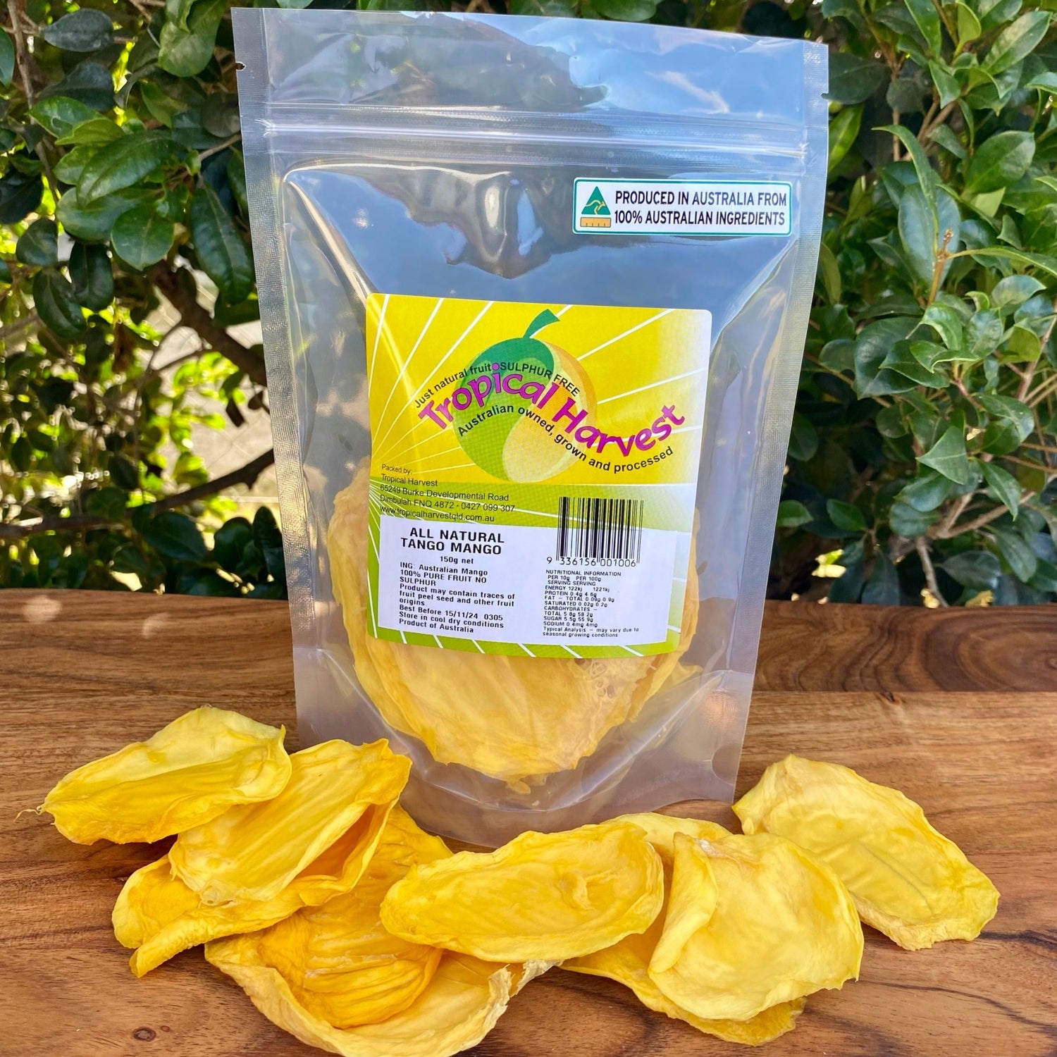 150g pack of Tropical Harvest Australian dried green mango with visible large slices and chewy texture, showing the pale colour unique to underripe mango.