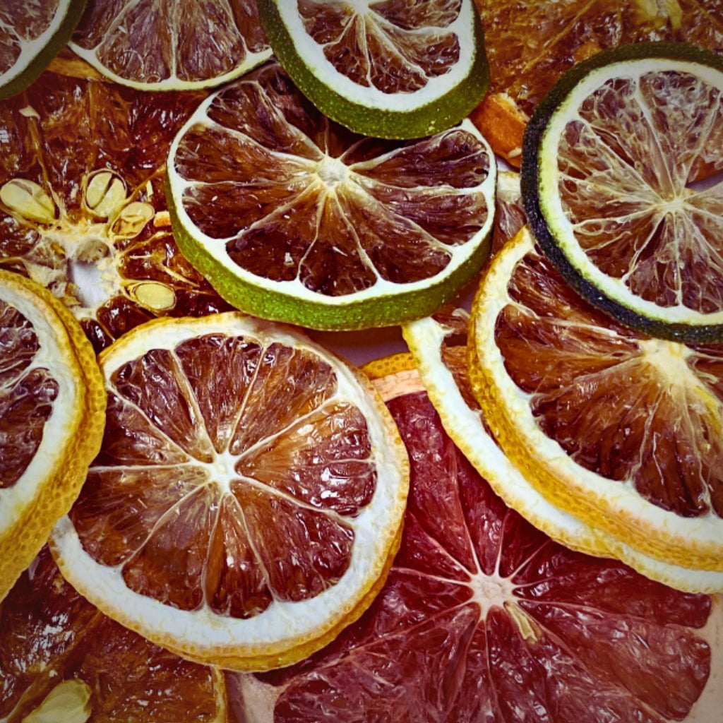 Close-up of 100% Australian dried citrus slices including lemon, lime, orange, and blood orange — vibrant and naturally preserved
