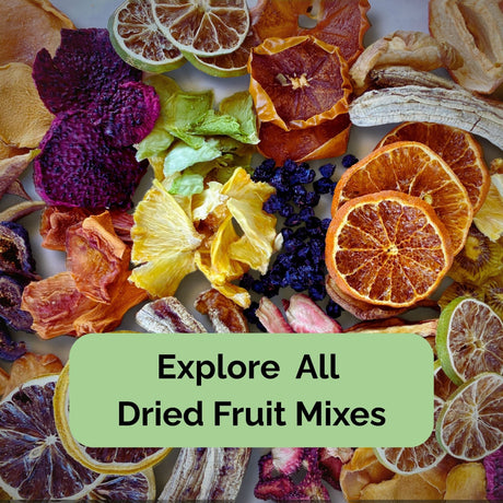 Assorted mix of Australian dried fruit slices including citrus, pineapple, banana, and berries — colourful blended fruit snack