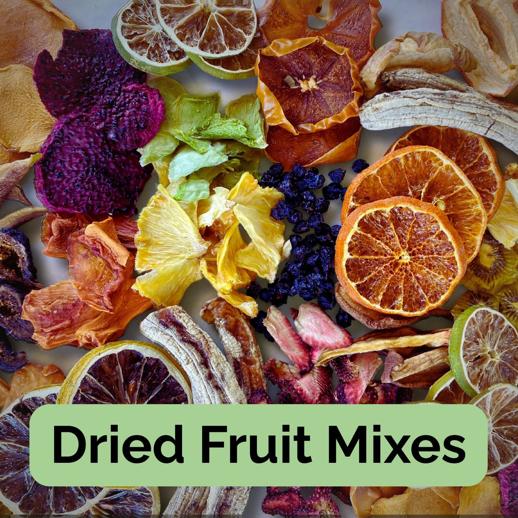 Assorted mix of Australian dried fruit slices including citrus, pineapple, banana, and berries — colourful blended fruit snack