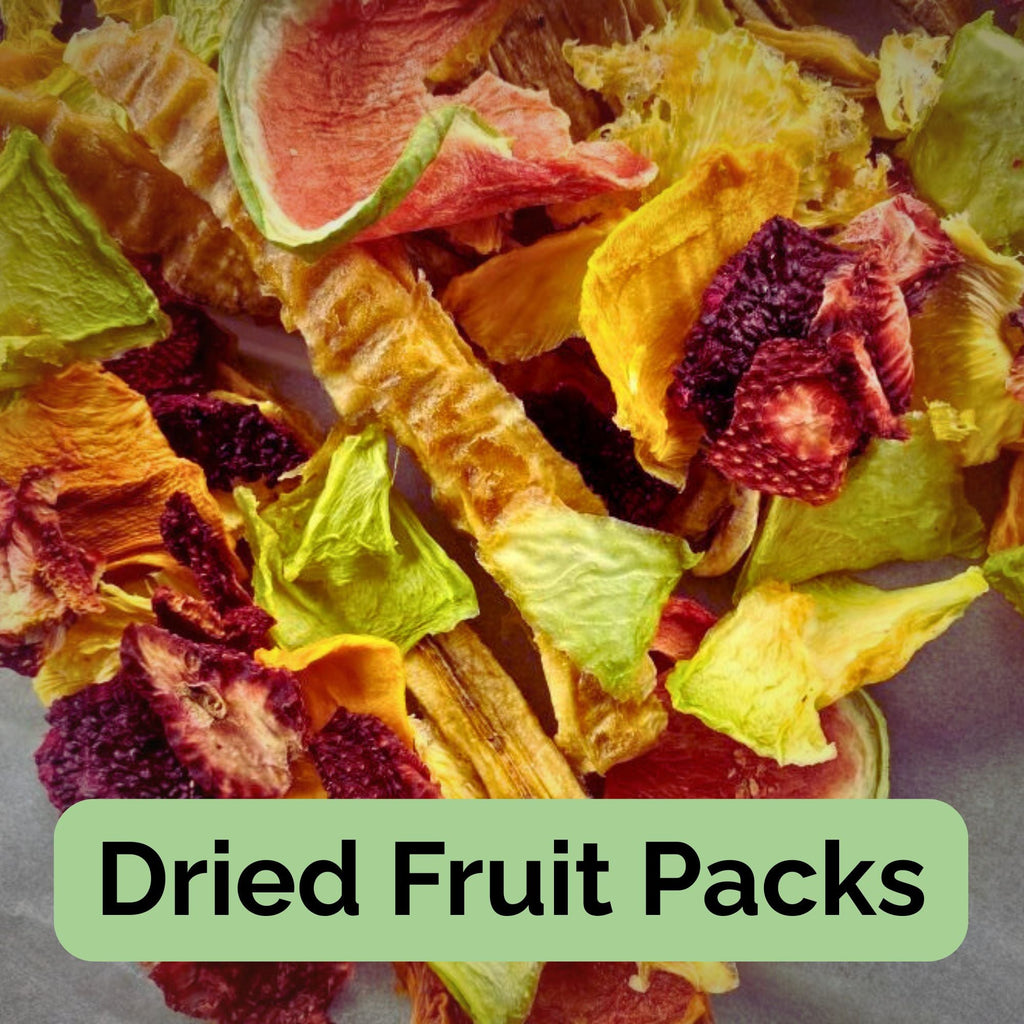 Selection of Australian dried fruit pieces including mango, watermelon, strawberry, and banana — representing individual fruit pack options