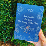 Close-up of 2026 diary with navy bee cover – Bee Humble, Bee Kind, Bee Loving All the Time