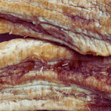Close-up of Australian dried banana whole showing chewy slow-dried fruit texture