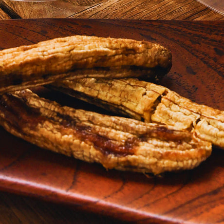 Whole dried banana pieces showing thick chewy texture, not sliced, Australian dried fruit