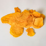 Australian dried green mango minis showing pale, firm slices made from mango dried before full ripeness.