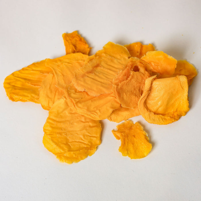 Australian dried green mango minis showing pale, firm slices made from mango dried before full ripeness.