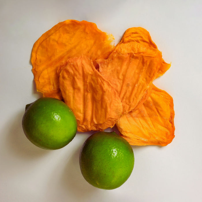 Australian dried mango slices with fresh whole limes showing mango lime flavour