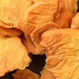 Close-up texture of chewy Australian dried mango minis slices.