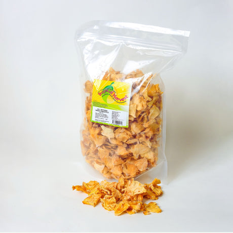 1kg pack of Tropical Harvest Australian dried pineapple pieces in resealable pouch