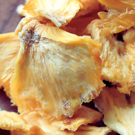 Close-up of natural Australian dried pineapple pieces showing fibrous fruit texture