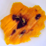 Texture close-up of Australian dried mango with natural caramelised sugars formed during slow drying.