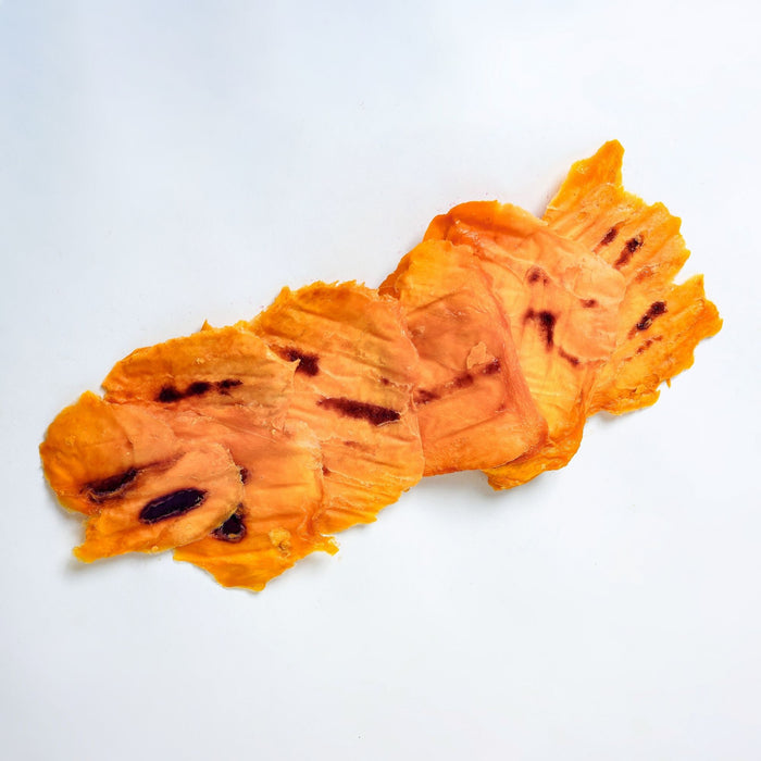 Close-up of Australian caramelised dried mango slices showing natural sugar caramelisation and rich amber colour.