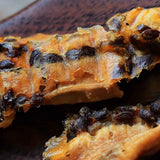 Chewy dried banana infused with passionfruit showing soft texture and natural fruit fibers