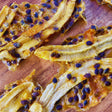 Dried banana infused with passionfruit showing vibrant seeds and rich chewy texture