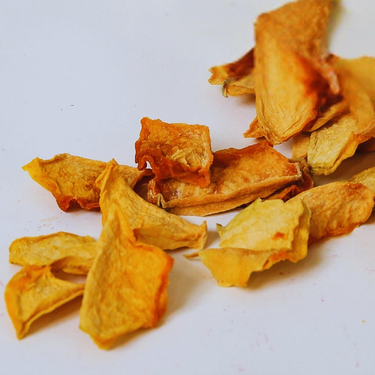 Close up of dried cantaloupe showing texture of natural dried fruit pieces