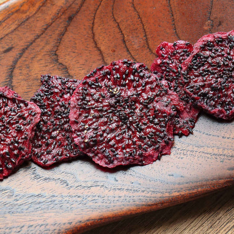 Dried dragon fruit slices served on board healthy snack idea