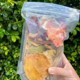 Dried fruit mix bag held in hand showing natural fruit pieces with no added sugar or preservatives