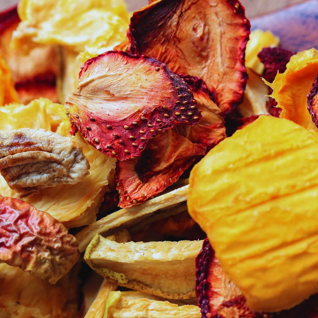 Close-up of dried fruit mix showing mango, strawberry and banana pieces for kids snacks