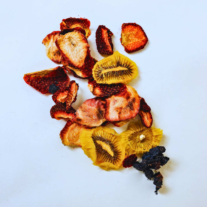 Dried fruit mix with kiwi strawberry and blueberry on white background for healthy snacking