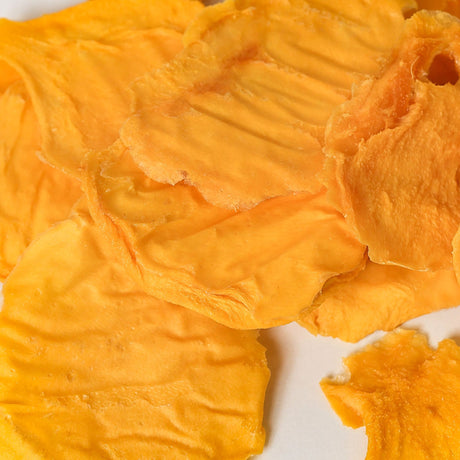 Australian green mango minis in a 500g pouch with firm dried mango slices made before full ripeness.