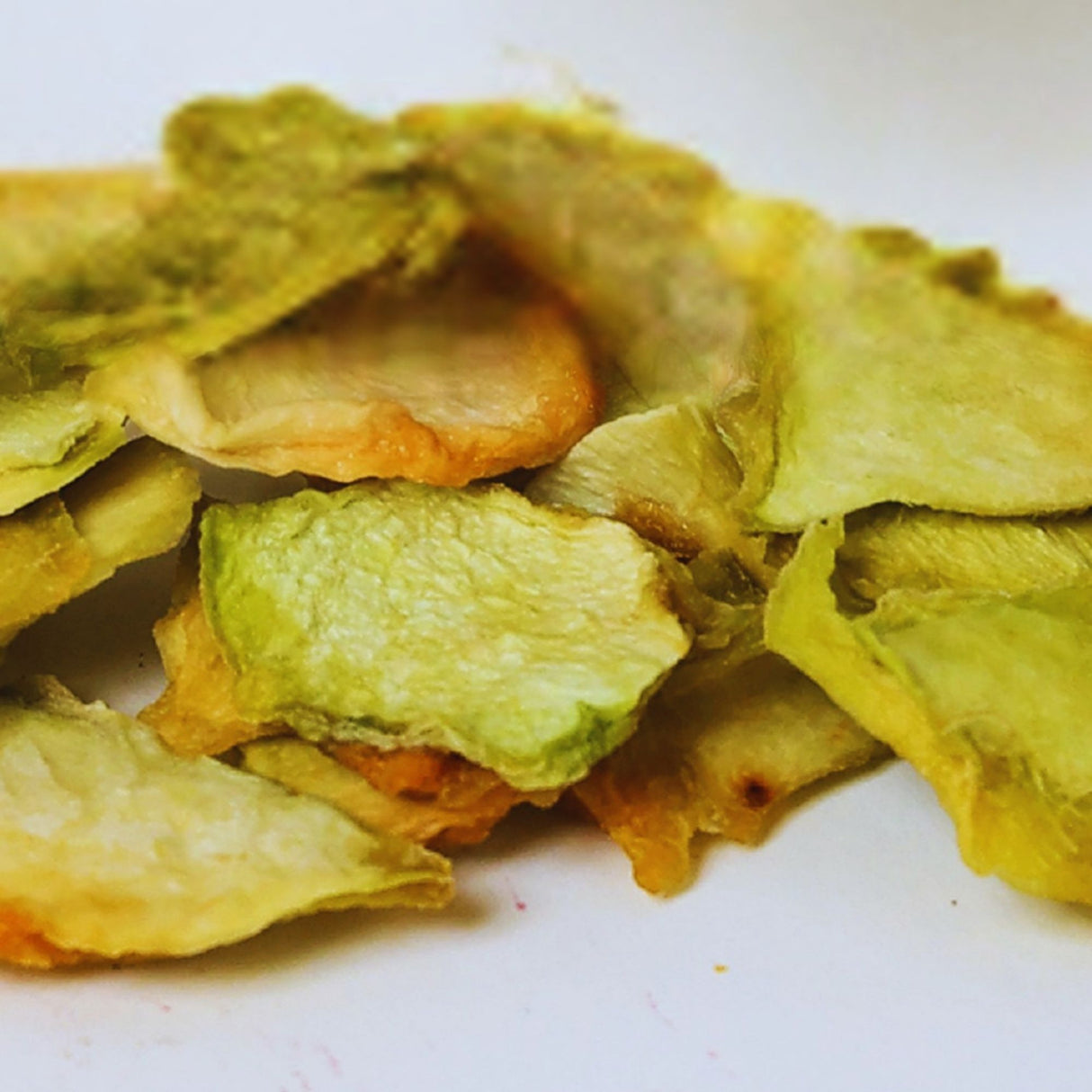 Close-up of dried honeydew melon slices showing natural texture and color