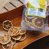 Dried lemon slices from 70g pack poured onto tray showing natural texture and quality