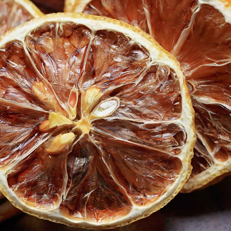 Close-up of dried lemon slices showing texture and natural color for drinks and garnishes