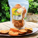 150g pack of dried mandarin slices displayed on tray showing natural product quality