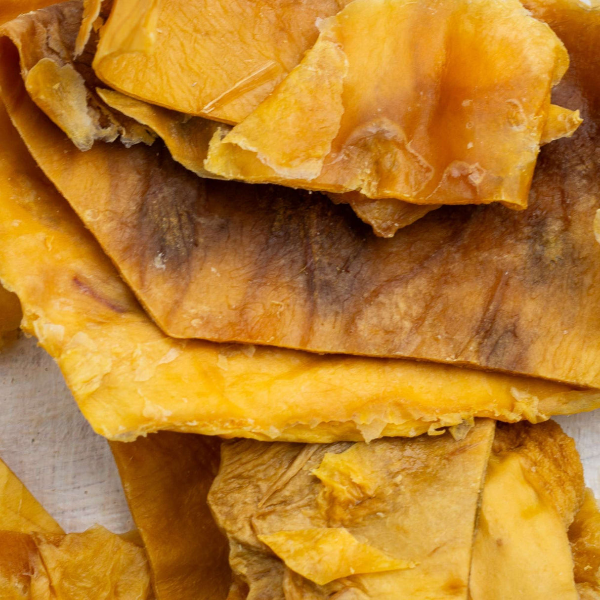 Close-up of natural dried mango pieces for pets