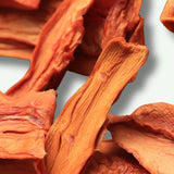 Close up of dried papaya texture showing natural fruit pieces for snacking