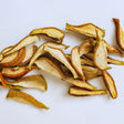 Dried pear slices on white background for healthy snacking and natural fruit snack