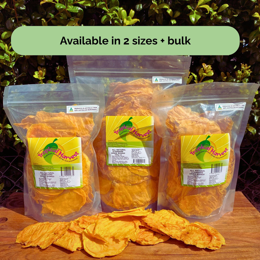 Three Tropical Harvest dried mango packs on display in 2x500g, and 1kg size with label visible – caption reads ‘Available in 2 sizes + bulk’

