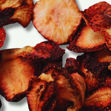 Close up of dried strawberry slices showing texture and natural fruit detail