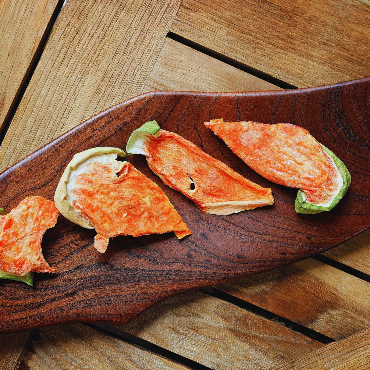 Dried watermelon slices served on board ready to eat fruit snack
