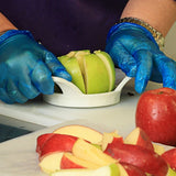 Fresh apples being sliced by hand showing preparation process for dried apple slices