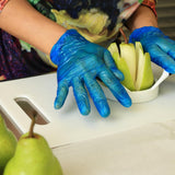Fresh pears being sliced by hand showing preparation process for dried pears